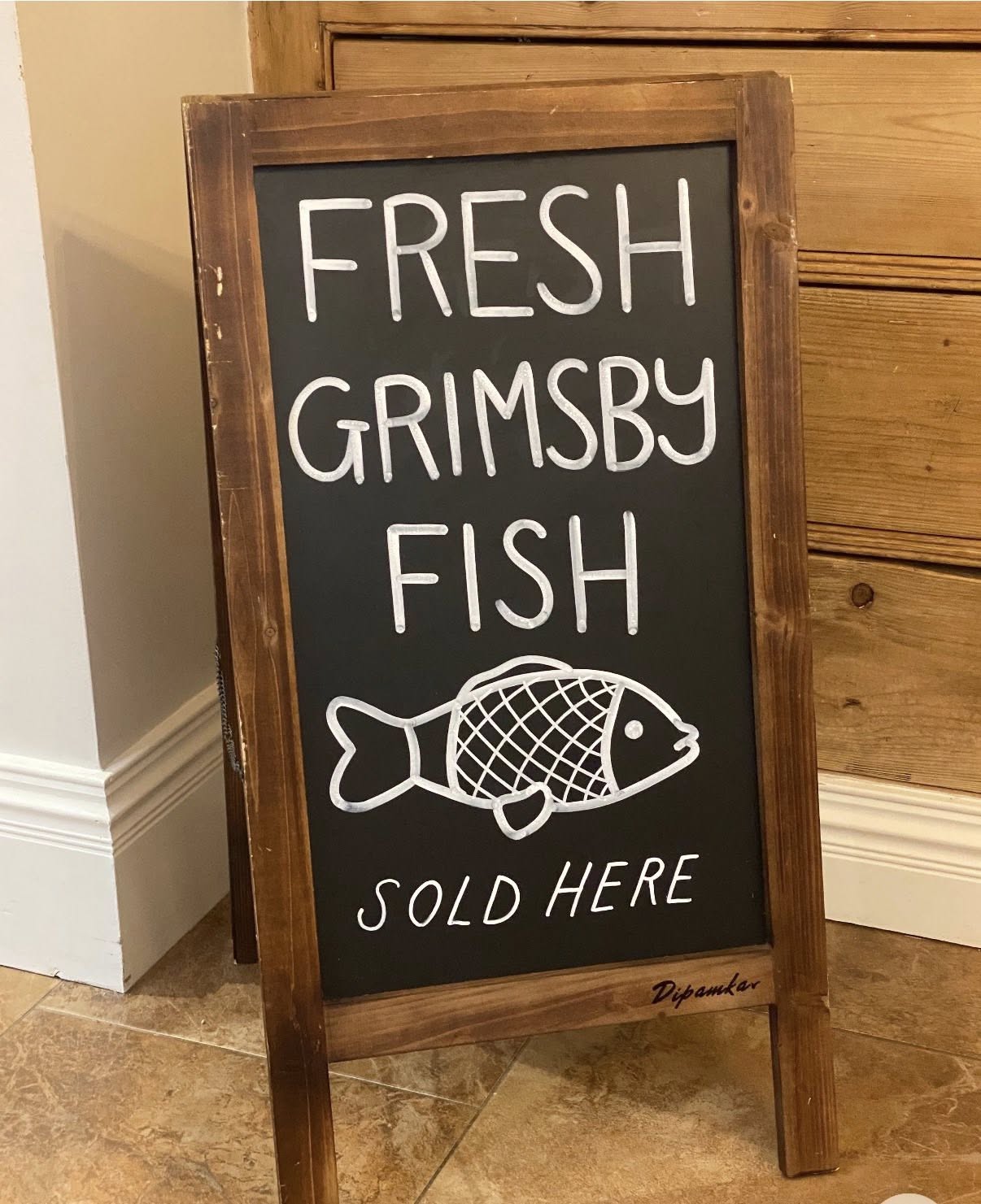Fresh Grimsby Fish sold here chalkboard sign